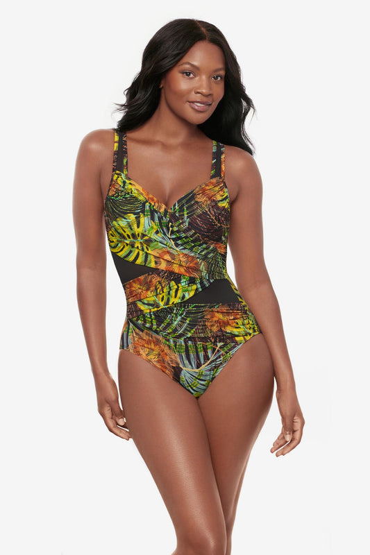 Woman wearing a multicolored palm leaf printed one-piece swimsuit