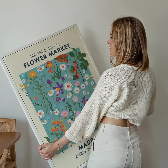 Madrid Flower Market Print held up against a living room wall