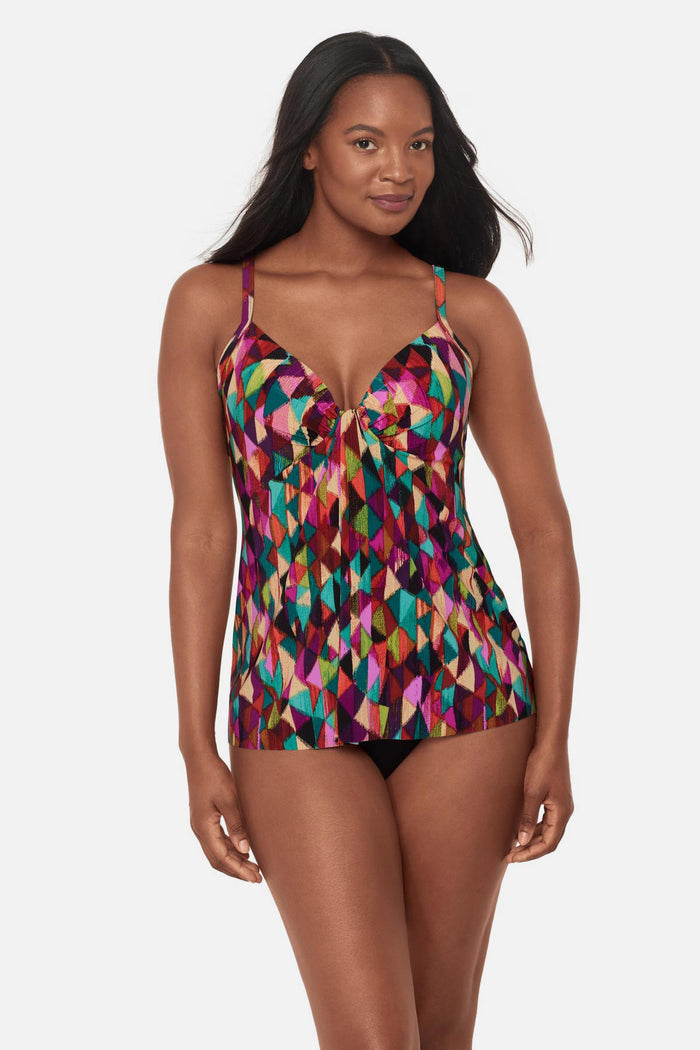 Woman wearing a multicolored geometric printed tankini top