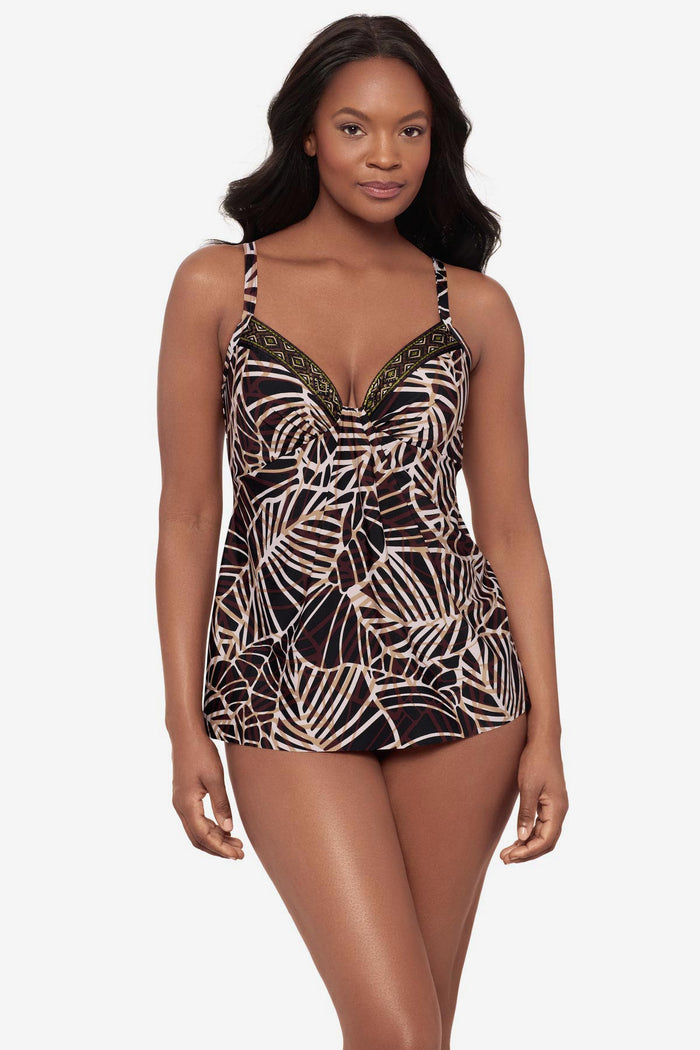 Woman wearing a brown printed tankini top with a detailed print along the neckline