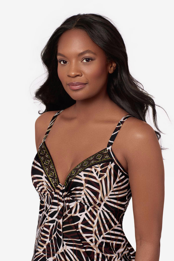 Close up of woman wearing a brown printed tankini top with a detailed print along the neckline