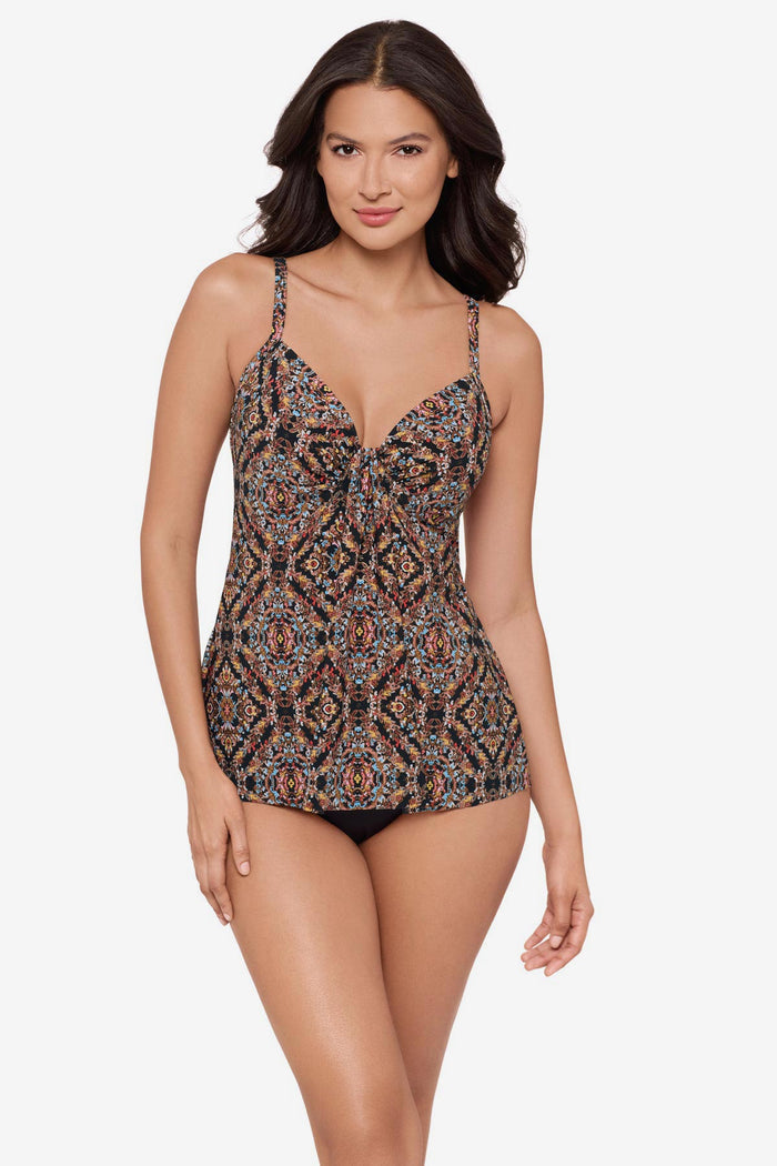 Woman wearing a multicolor tankini top with a V neckline