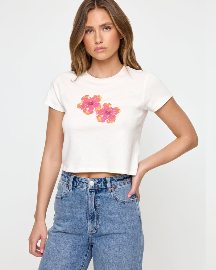 LSPACE Merci baby tee in Maui Babe print, side view on model.