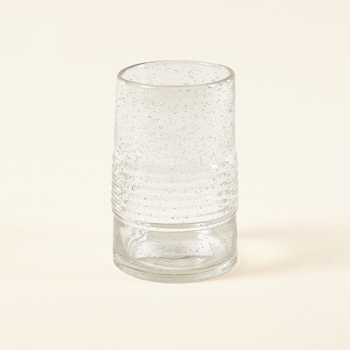 Merida glassware with bubbles inside and a ribbed section in the middle.