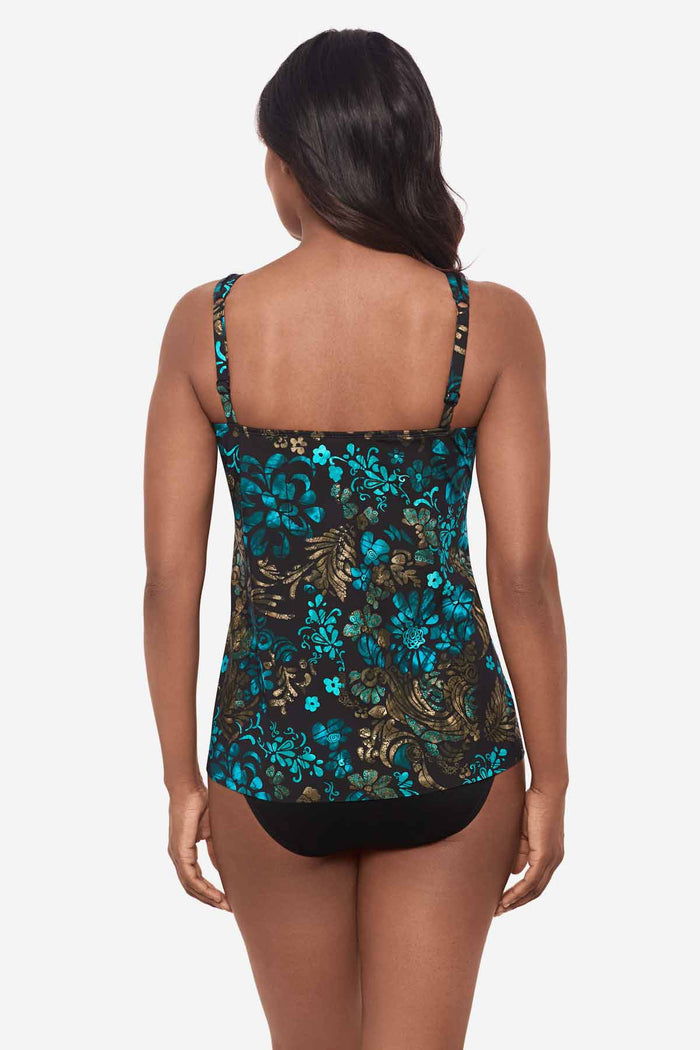 Woman facing away wearing a multicolor tankini top