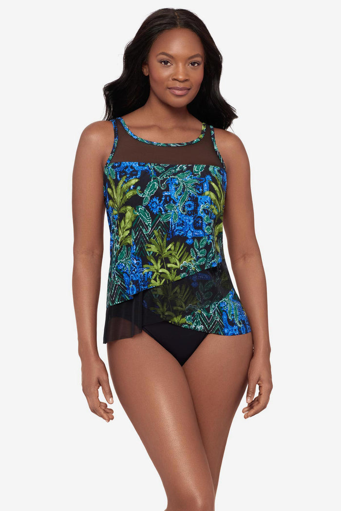 Woman wearing a mesh detail tankini top with a multicolor abstract print