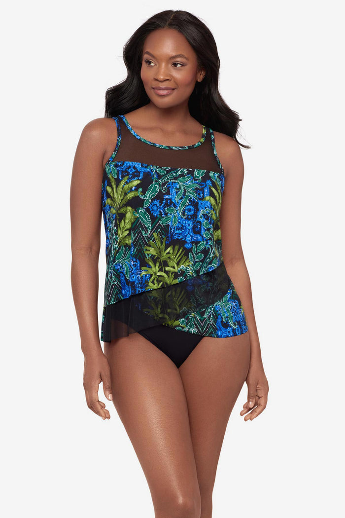 Woman wearing a mesh detail tankini top with a multicolor abstract print