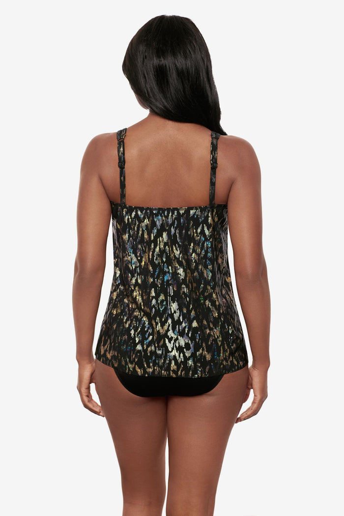 Woman turned away wearing a black sparkly tankini top
