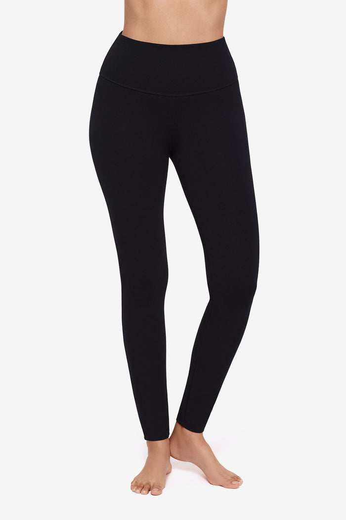 Close up of Woman's legs in black leggings