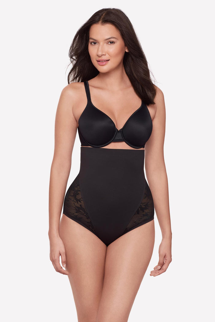 Woman wearing a black lacey high waisted shaping brief
