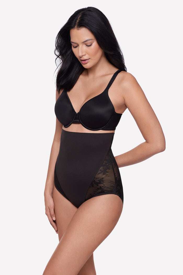 Woman turned left wearing a black lacey high waisted shaping brief