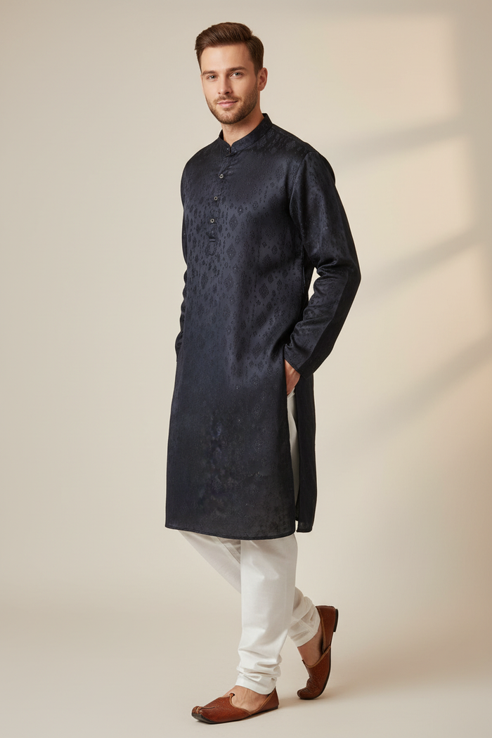 Navy embroidered kurta set three-quarter angle on male model with white pajama and mojari footwear