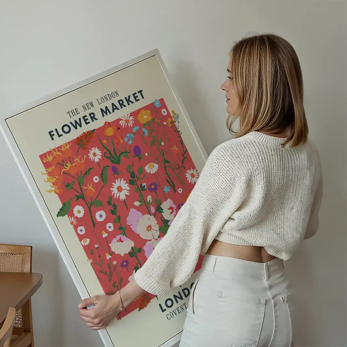 New London Flower Market Print held up against a living room wall