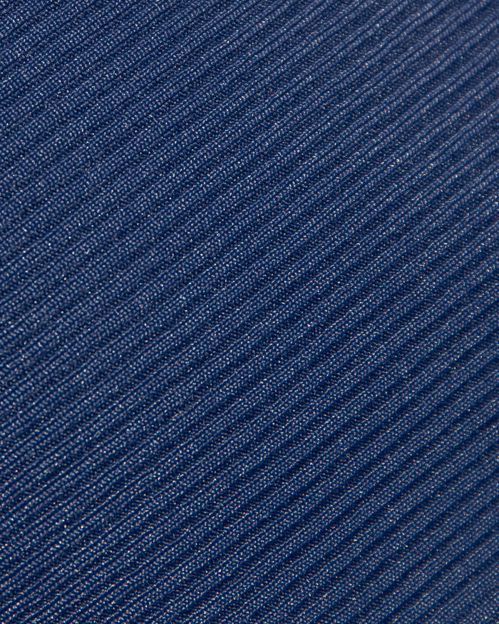 Close-up detail of the LSPACE midnight cream fabric swatch showing the navy blue material with subtle metallic shimmer texture for the Nora Bikini Bottom.