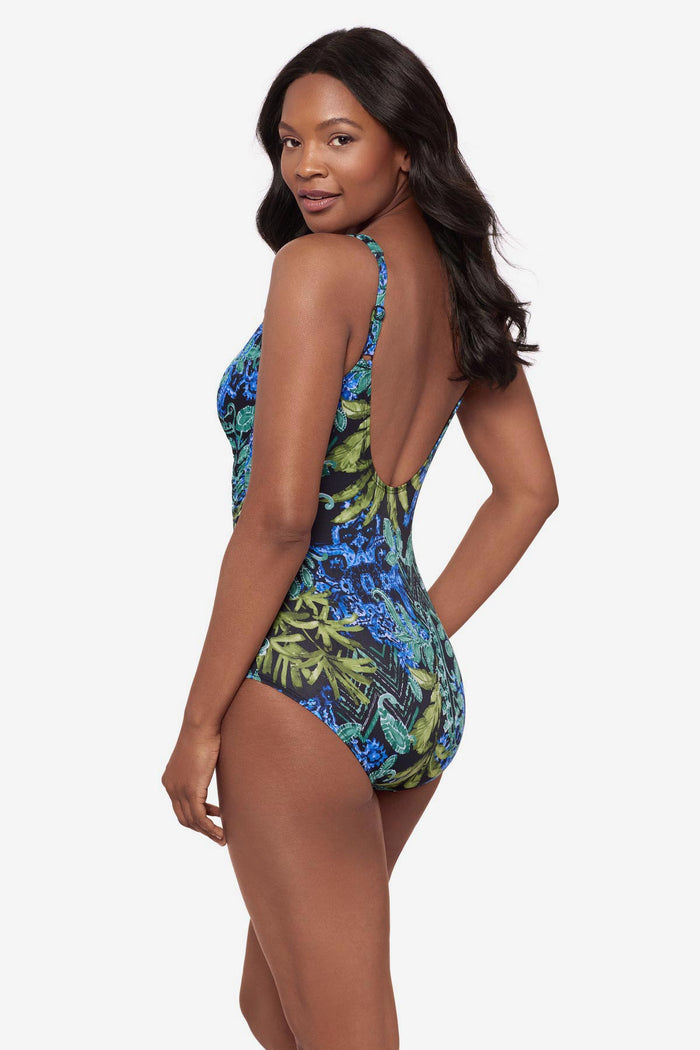 Woman turned left wearing a multicolor abstract print swimsuit