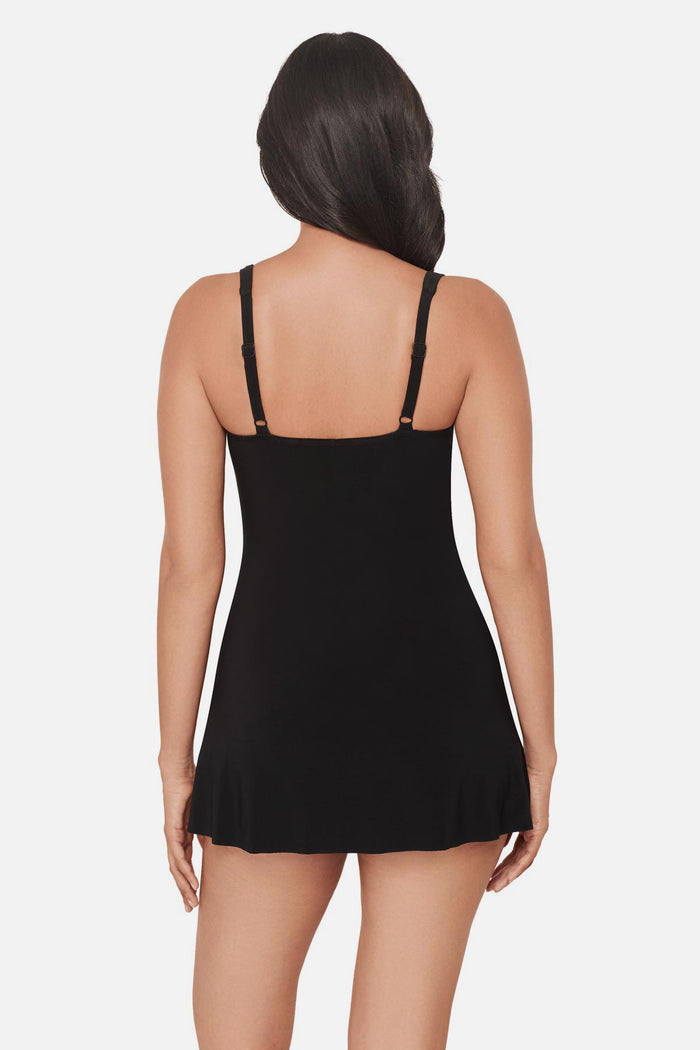 Woman faced away wearing a black square neck swim dress