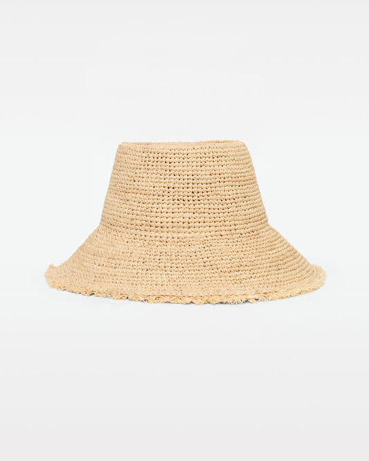 Off-model front view of the Paco Bucket Hat in natural, a crochet raffia bucket hat with a frayed raw edge brim, on a white background.