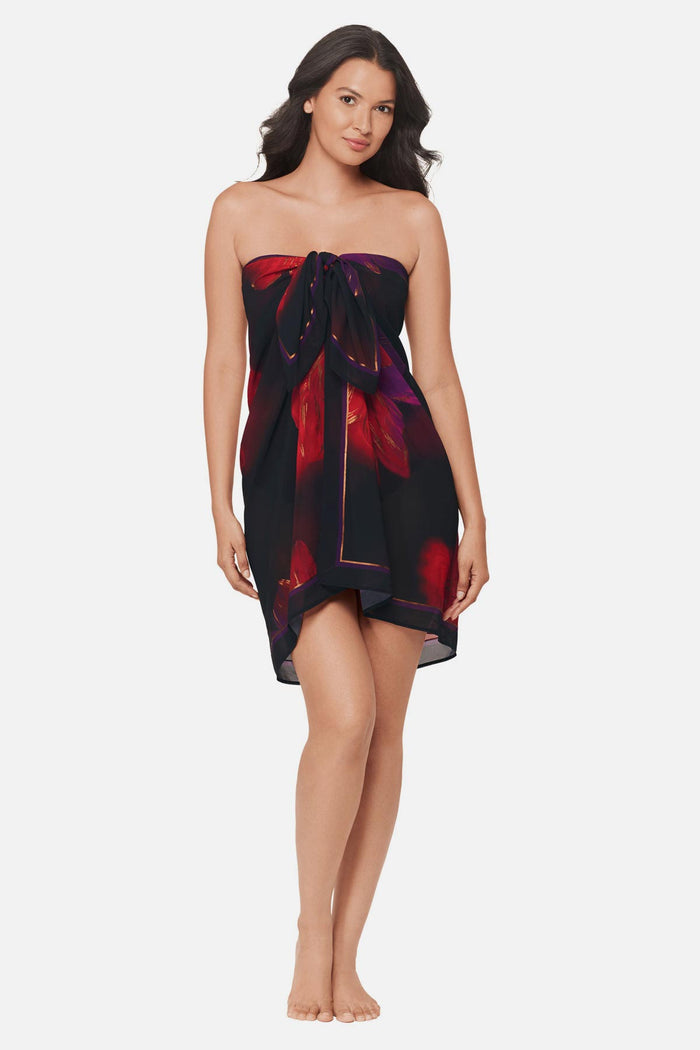 Woman wearing a multicolored floral printed pareo swim cover up