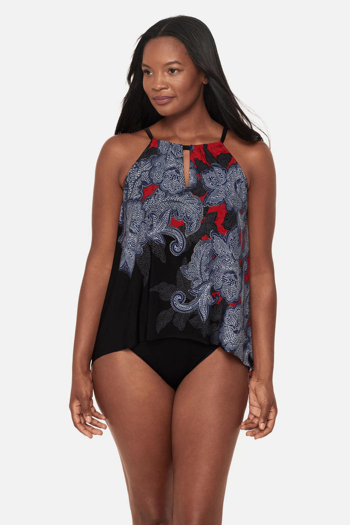 Woman wearing a multicolored abstract floral printed peep hole tankini top