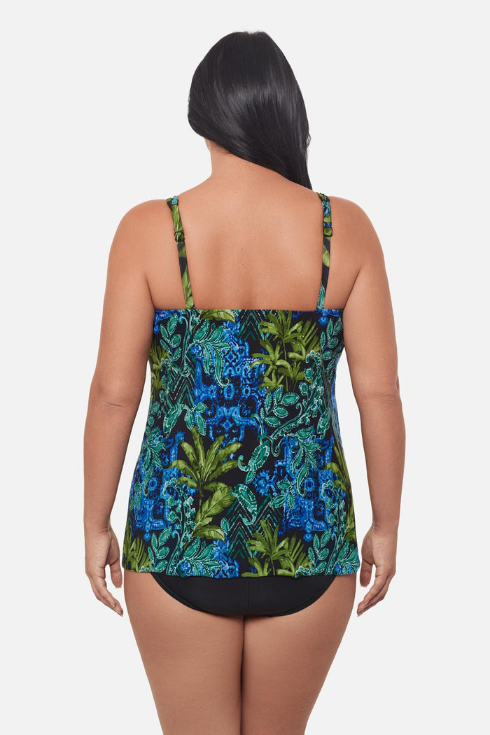 Woman turned away wearing a blue and green abstract print tankini top