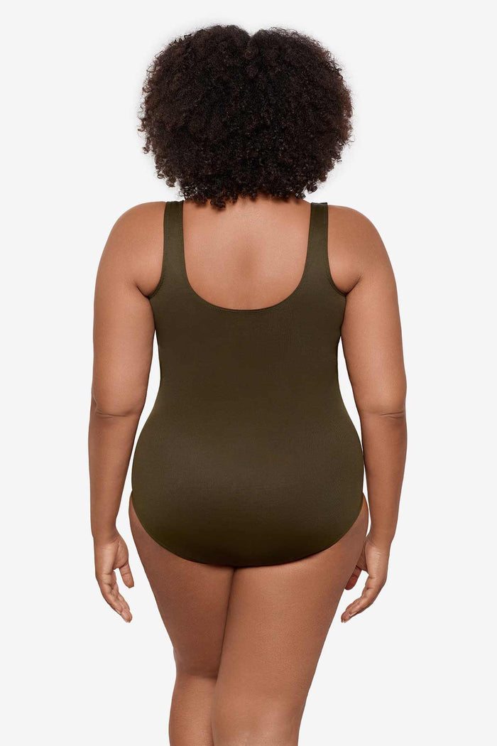 Woman turned away wearing a nori green one-piece swimsuit
