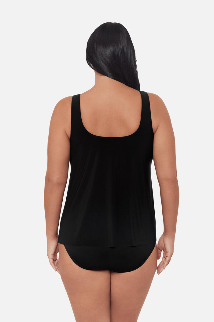 Woman turned away wearing a black tankini top