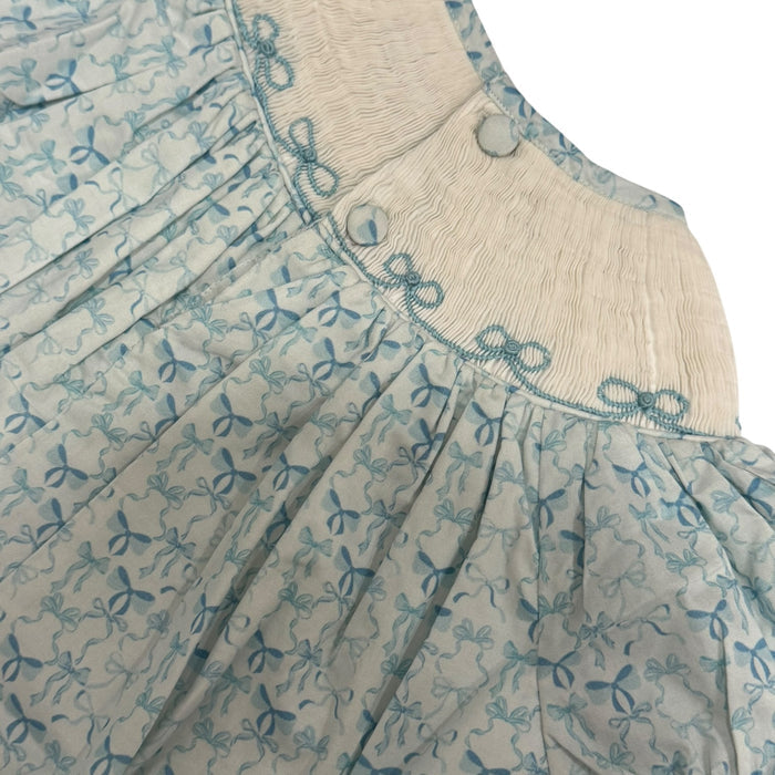 Close-up of gathered neckline and soft blue bow print on Big Sister Bishop Dress