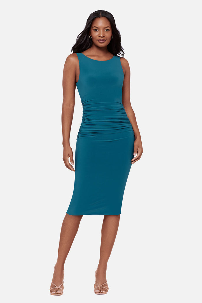 Woman wearing a blue sleeveless mid length dress
