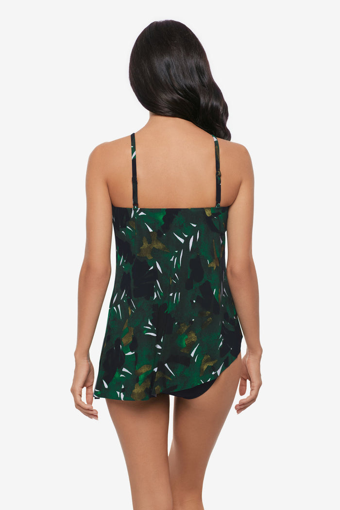 Woman turned away wearing a high neck tankini top with a palm leaf print