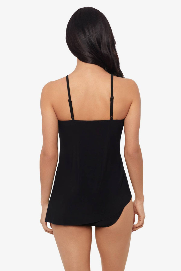 Woman facing away wearing a black tankini top