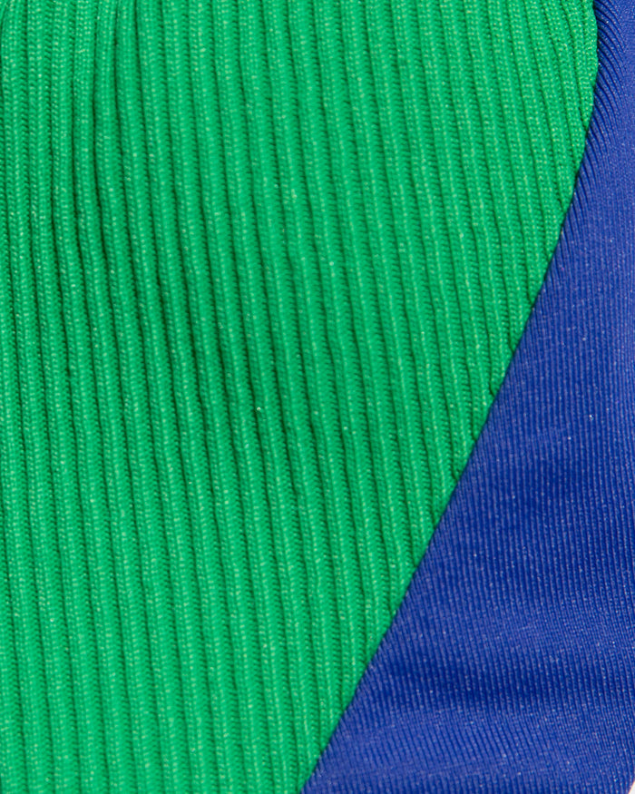 Close-up of green and blue ribbed fabric.