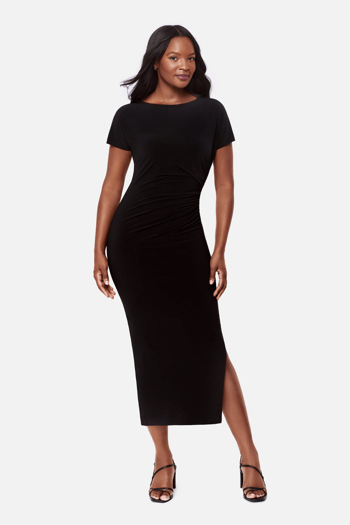 Woman wearing a black short sleeve full length dress