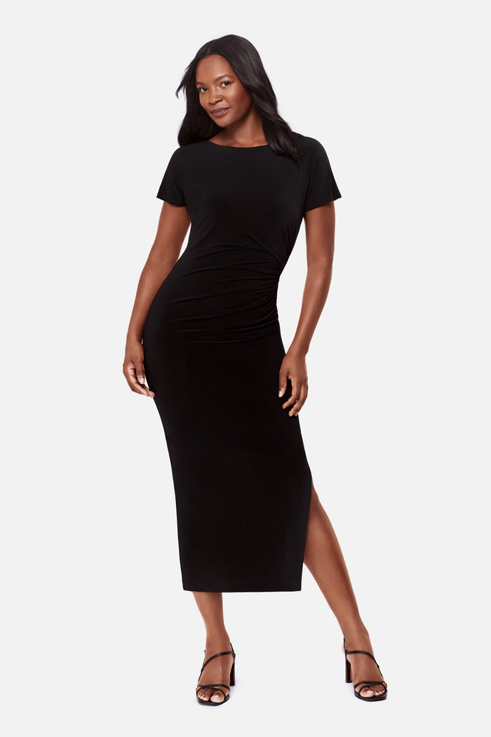 Woman wearing a black short sleeve full length dress