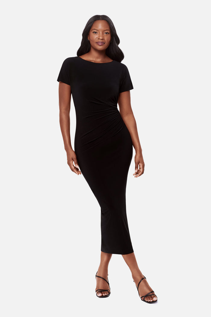 Woman wearing a black short sleeve full length dress