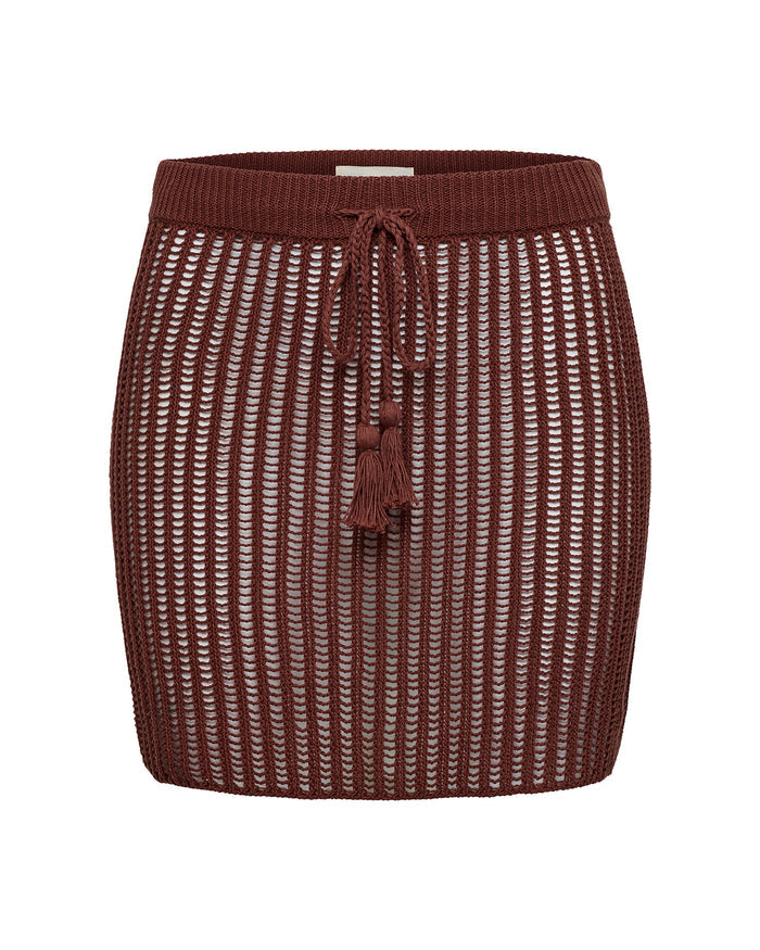 Off-model view of the LSPACE Sander Skirt in sangria, displayed on a white background showing the knit waistband, tassel drawstring tie, and open-weave crochet construction in deep burgundy.