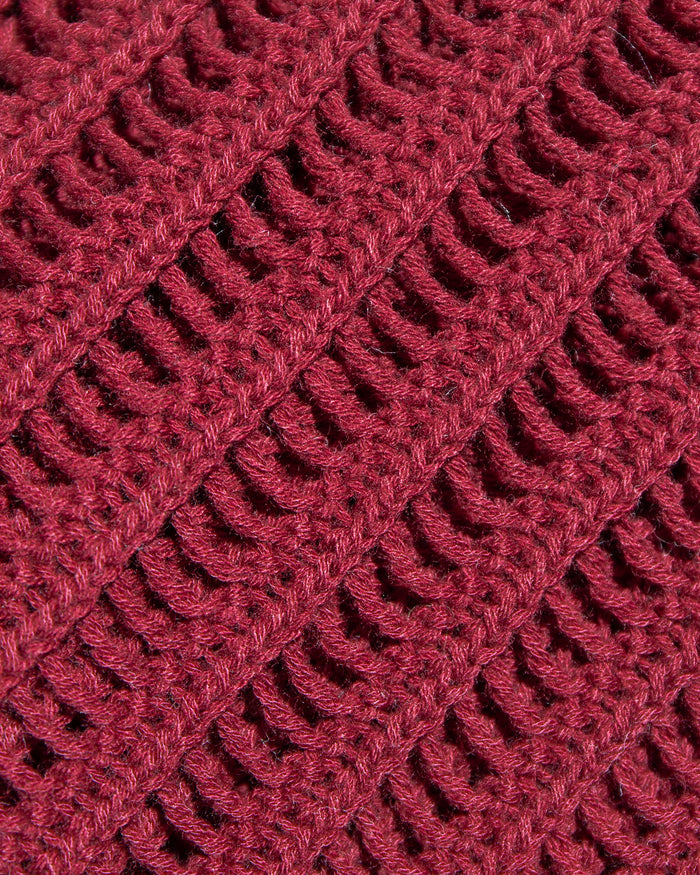Close-up of the LSPACE Sander Top in sangria, highlighting the detailed open-weave crochet stitch pattern in deep burgundy.