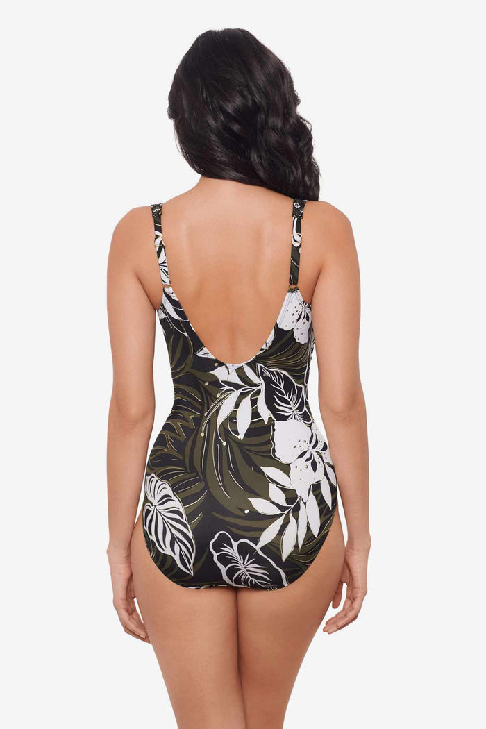 Woman turned away wearing a multicolor one-piece swimsuit