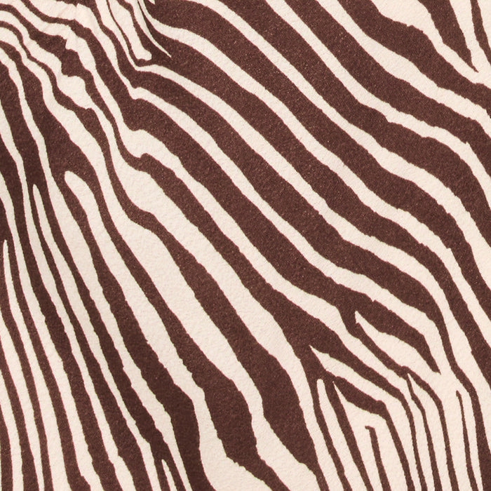 Close-up swatch of the LSPACE Say When Maxi Dress in animal, highlighting the chocolate brown and cream zebra print fabric.