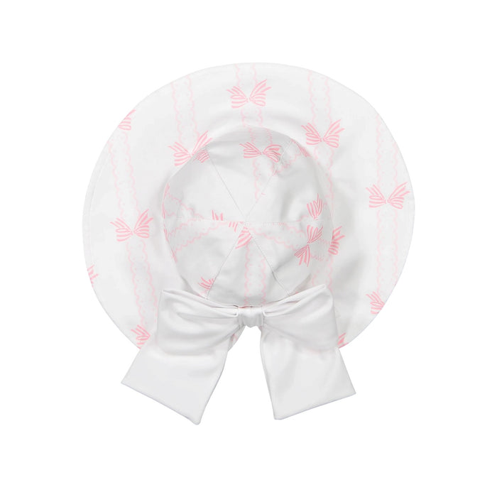 Scallops and Bows Lycra Sunny Hat in soft pink bow print with oversized white back bow