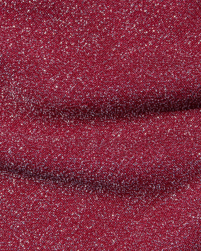 Close-up of the LSPACE Shimmer Long Sleeve in sangria, highlighting the sparkling metallic knit fabric with silver glitter throughout.