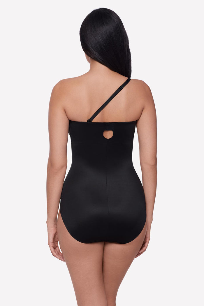 Woman faced away wearing a bandeau style black bodysuit