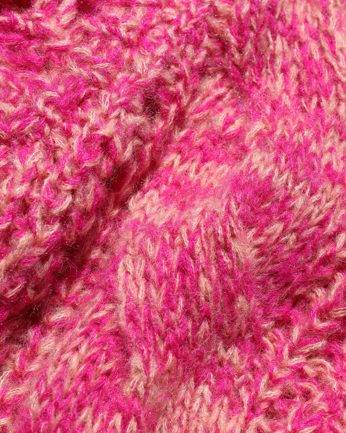 Close-up of the LSPACE Strawberry Fields Cardigan in strawberry marl, showing the marled pink and cream cable-knit yarn texture in detail.