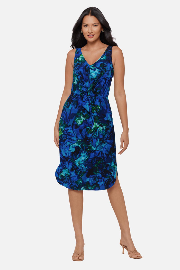 Woman wearing a blue celestrial printed sleeveless mid length dress