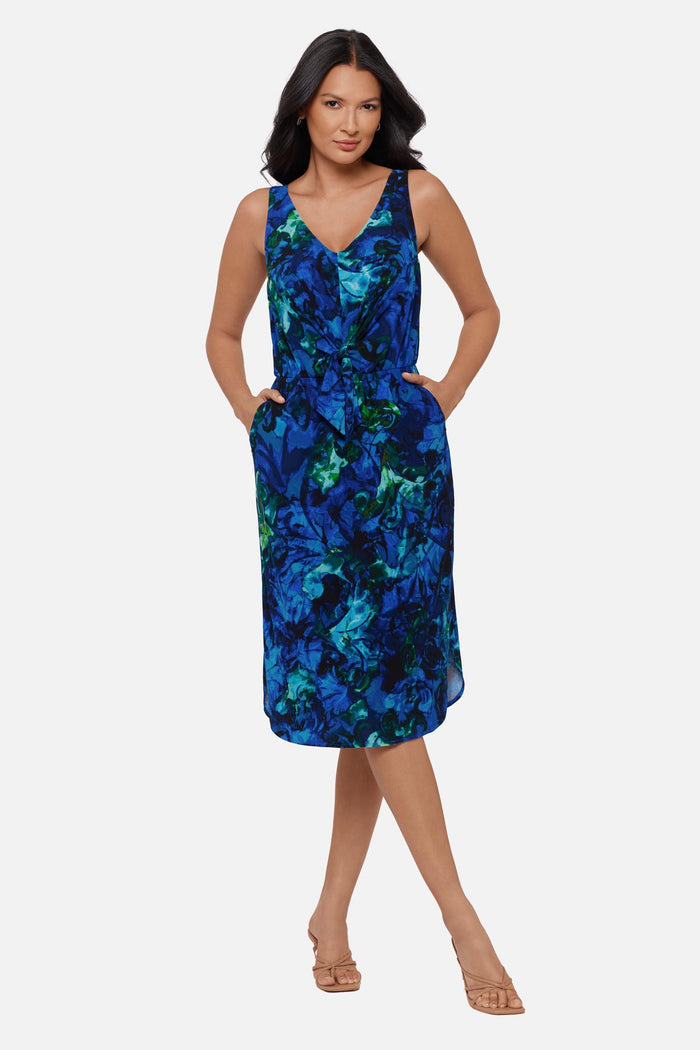 Woman wearing a blue celestrial printed sleeveless mid length dress