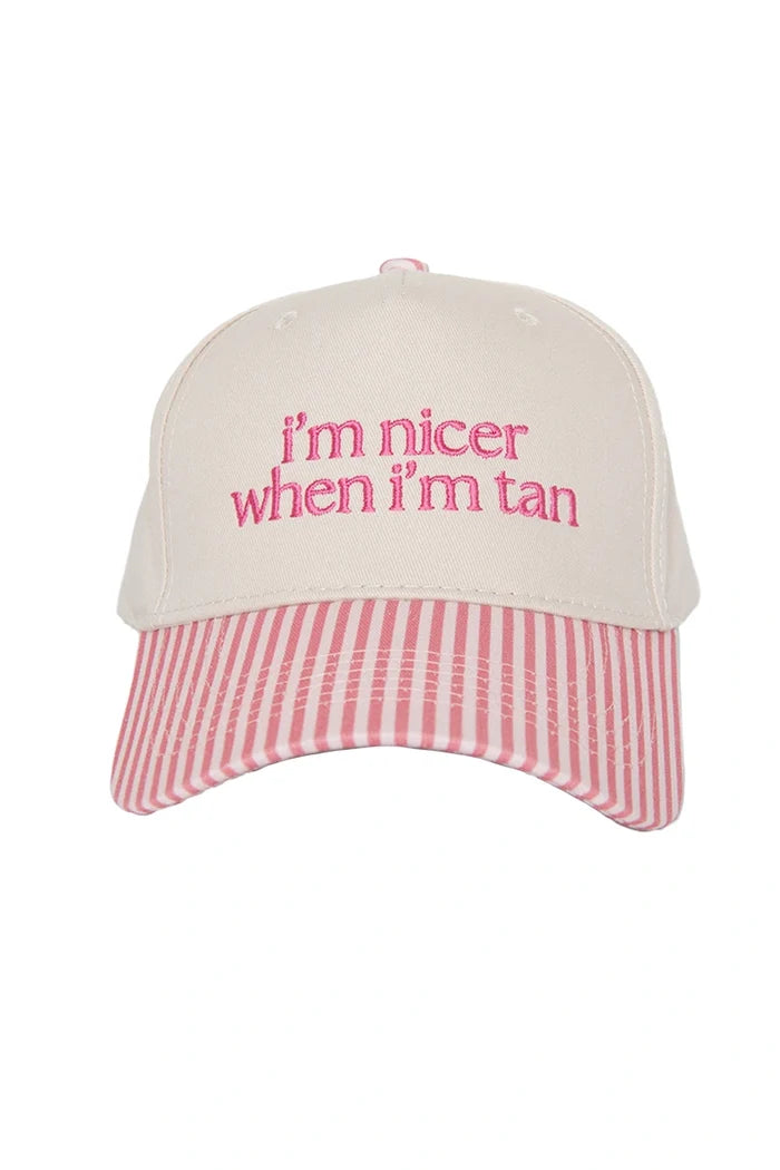 Cap with pink text 'I'm nicer when I'm tan' on a white background