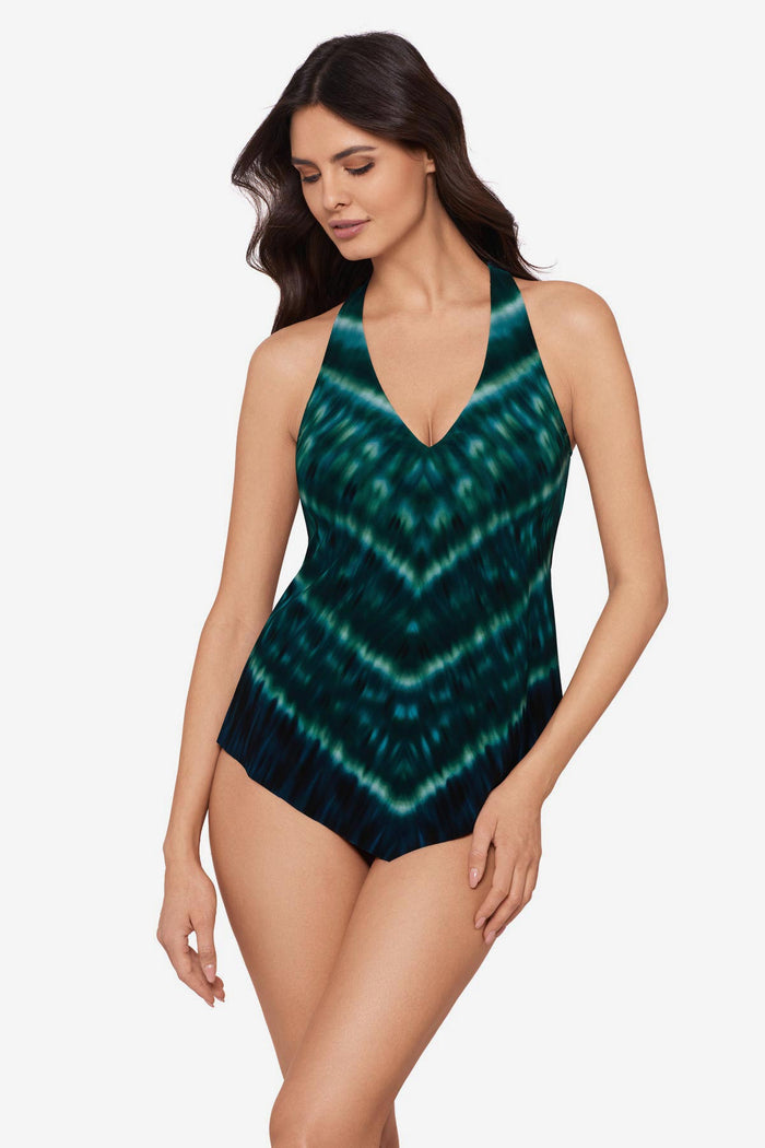 Woman wearing a green tie-dyed tankini top with a v-neck