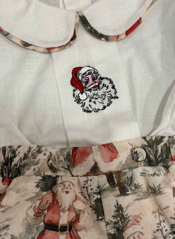 Close-up of rounded collar and embroidered Santa detail on The Santa Claus boy shirt