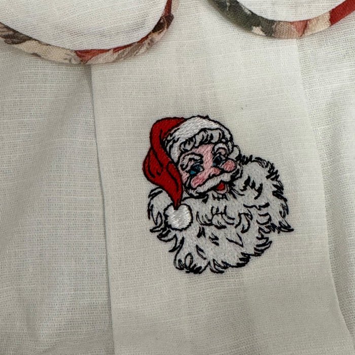 Close-up of embroidered Santa motif on The Santa Claus Christmas shirt