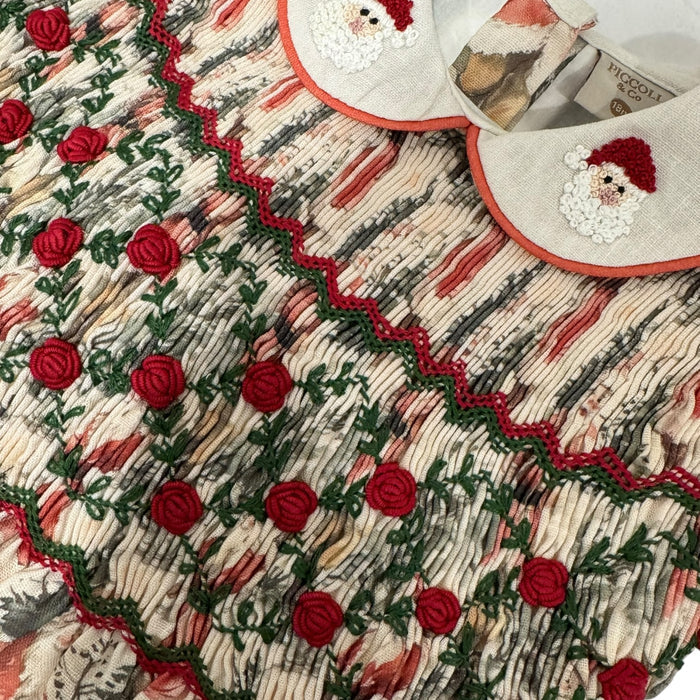 Close-up of red, green and ivory handsmocking on The Santa Claus Christmas Dress