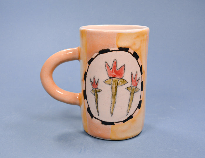 Ceramic mug with floral design on a blue background